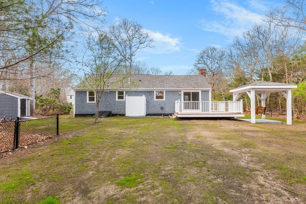 20 Nantucket Trail Sandwich, MA 02563 - Photo 29 of 30 a front view of a house with a garden