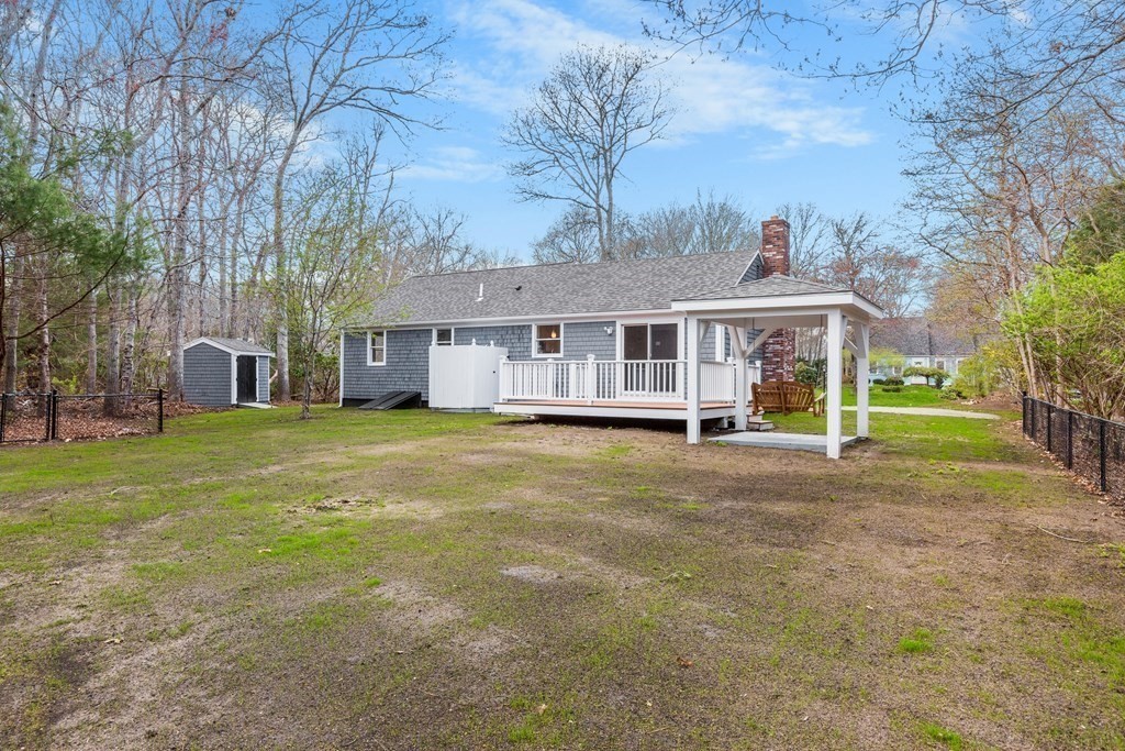 20 Nantucket Trail Sandwich, MA 02563 - Photo 30 of 30 a view of a house with a big yard and large trees