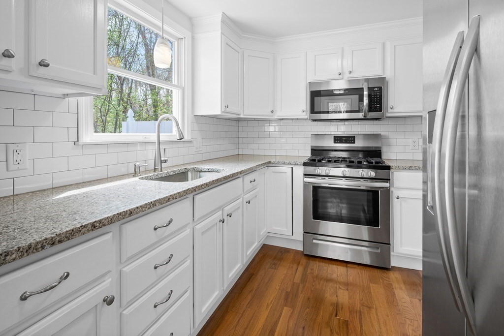 20 Nantucket Trail Sandwich, MA 02563 - Photo 5 of 30 a kitchen with sink a microwave and cabinets