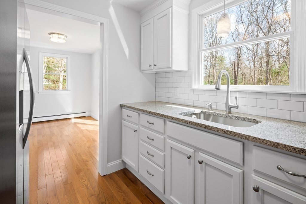 20 Nantucket Trail Sandwich, MA 02563 - Photo 7 of 30 a kitchen with granite countertop white cabinets and a window