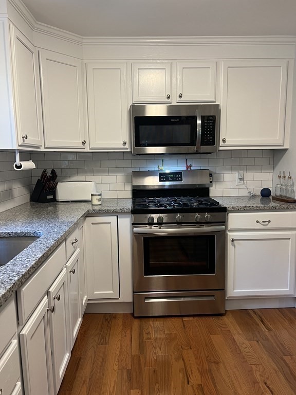 20 Nantucket Trail Sandwich, MA 02563 - Photo 8 of 30 a kitchen with granite countertop a stove and a microwave