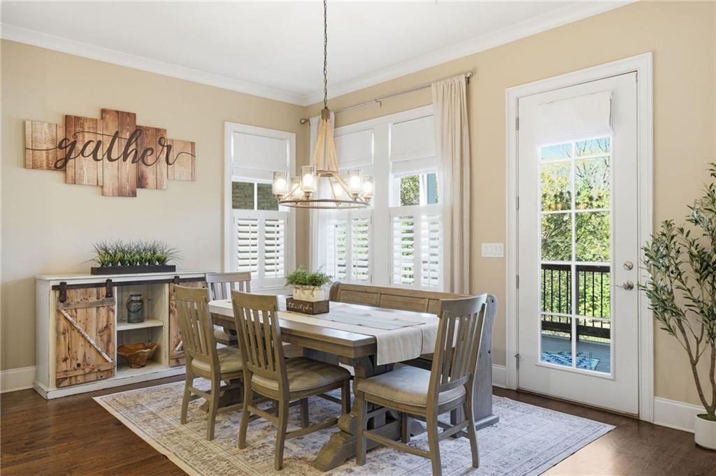 2085 Bellrick Road Northwest Atlanta, GA 30318 - Photo 17 of 78 a view of a dining room with furniture window and wooden floor