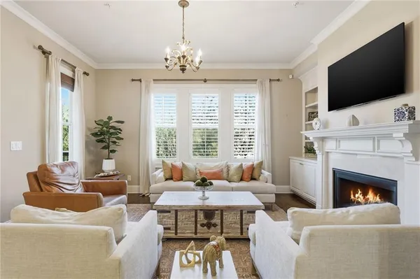 a bed room with a bed and a chandelier