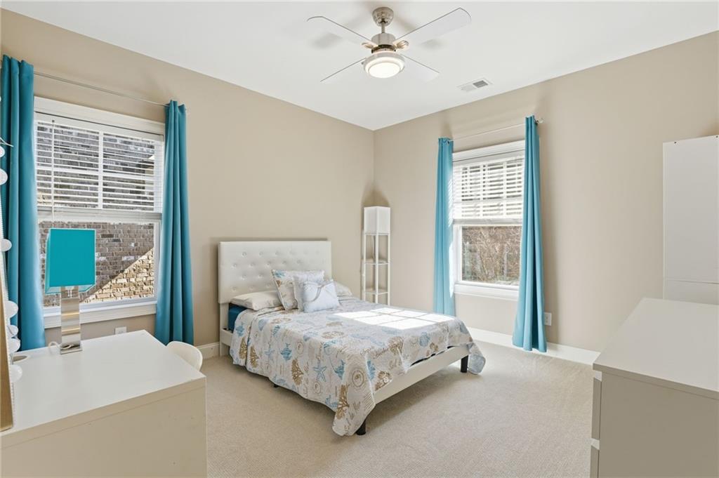 2085 Bellrick Road Northwest Atlanta, GA 30318 - Photo 36 of 78 a bedroom with a bed lamp and a large window