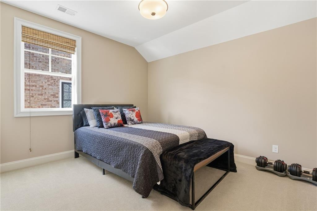 2085 Bellrick Road Northwest Atlanta, GA 30318 - Photo 47 of 78 a bedroom with a bed and a window