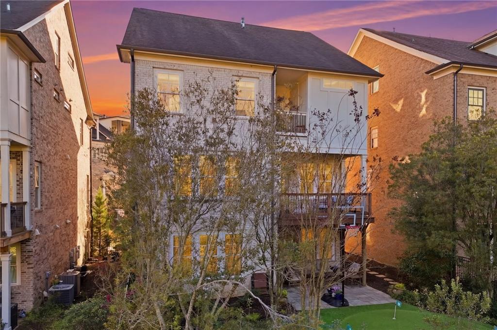 2085 Bellrick Road Northwest Atlanta, GA 30318 - Photo 62 of 78 a view of a brick house with a door and balcony
