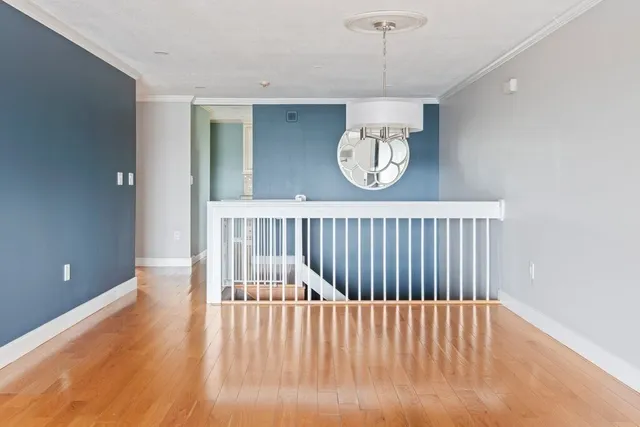 a view of a hallway with a chandelier