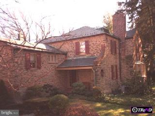 626 Ashbourne Road Cheltenham, PA 19012 - Photo 1 of 1 a view of a brick house with a large tree