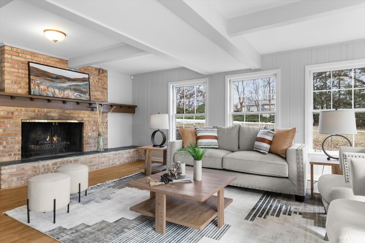 143 Firth Road Inverness, IL 60067 - Photo 17 of 38 a living room with furniture a large window and a fireplace