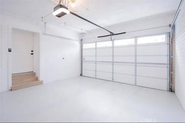 a balcony with furniture and a potted plant