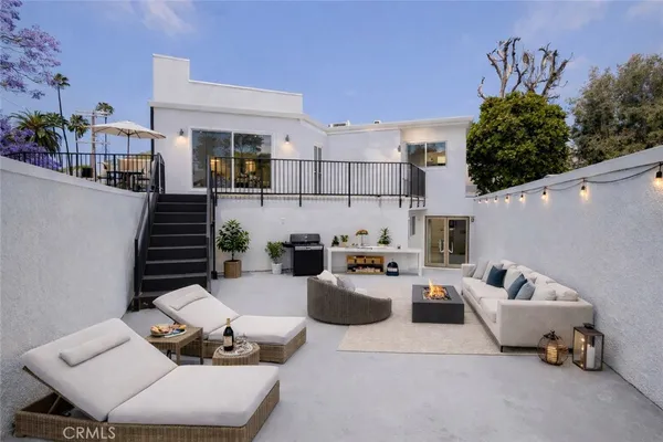 a view of balcony with wooden floor and fence