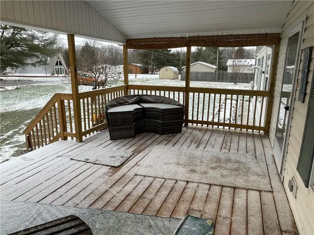 a view of a balcony with wooden floor