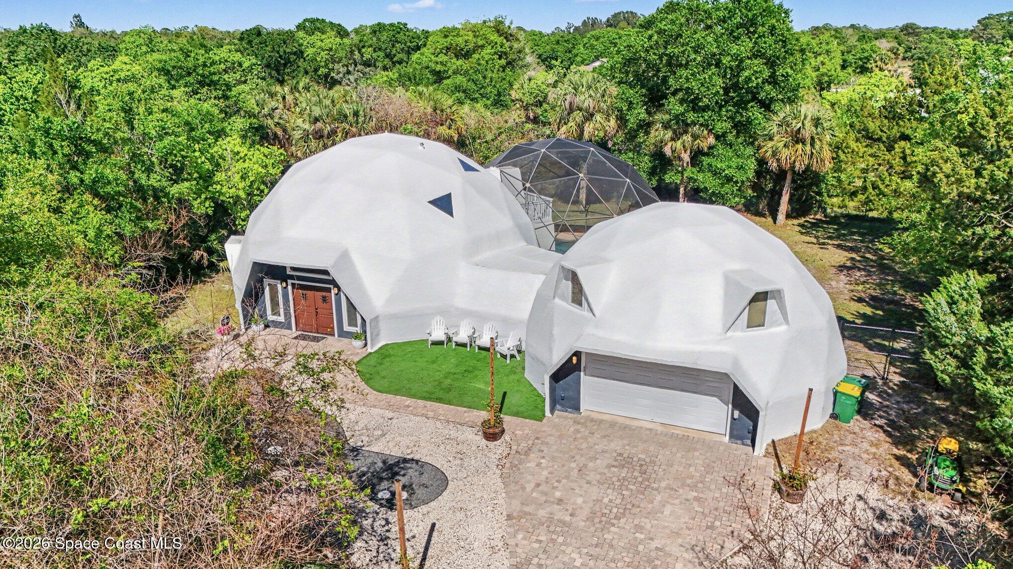 4045 Jake Avenue Cocoa, FL 32926 - Photo 25 of 35 a aerial view of a house with a yard and large trees