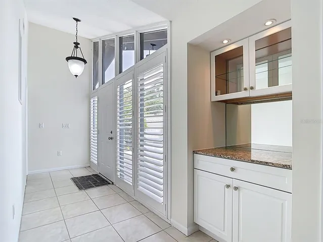 a view of a kitchen with microwave and cabinets