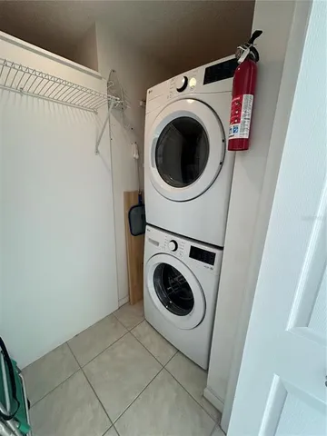 a view of empty room with cabinet and floor to ceiling window