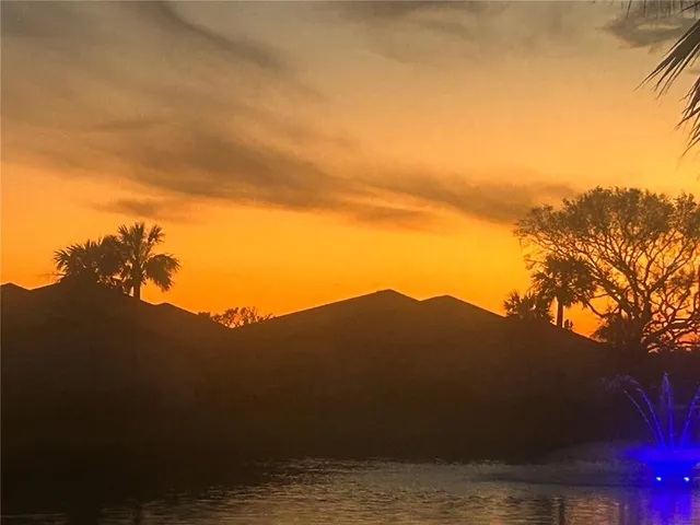 a swimming pool with outdoor seating and yard
