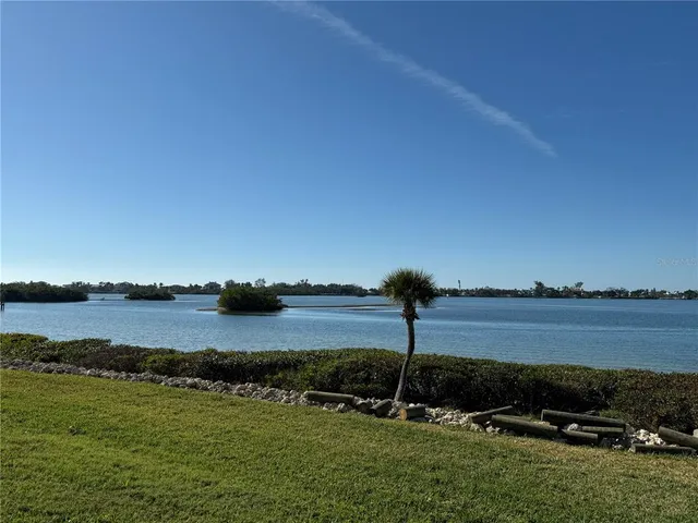 an aerial view of a house with swimming pool and seating space