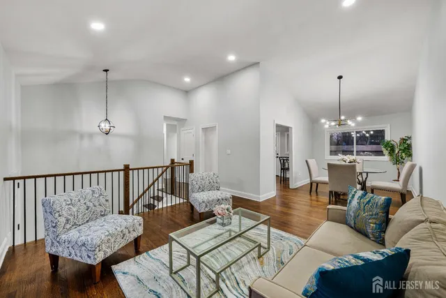 a living room with furniture and a table