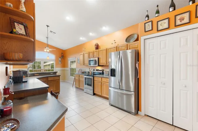 a bedroom with a bed and a lamp