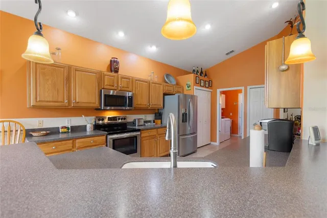 a bathroom with a granite countertop shower and a sink