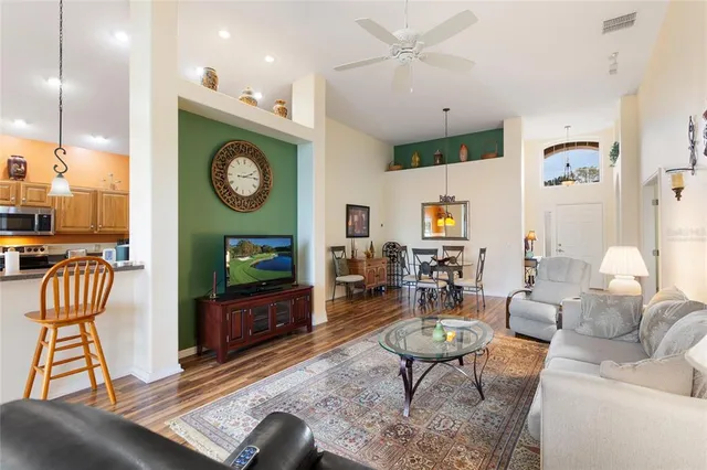 a bedroom with a bed and a dresser next to a window