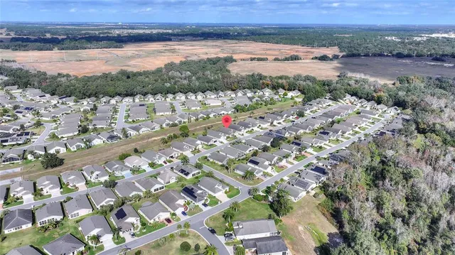 a kitchen with stainless steel appliances granite countertop a refrigerator a sink and dishwasher