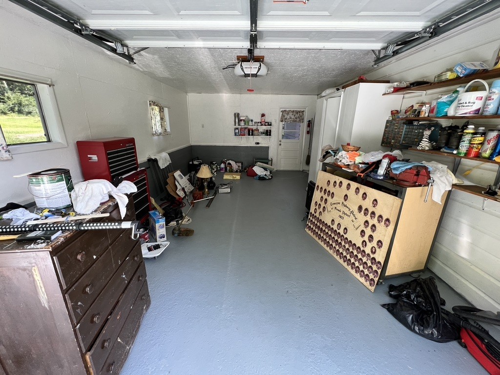 890 Hobbs Hill Road Tracy City, TN 37387 - Photo 13 of 31 a living room with lots of furniture and a chandelier