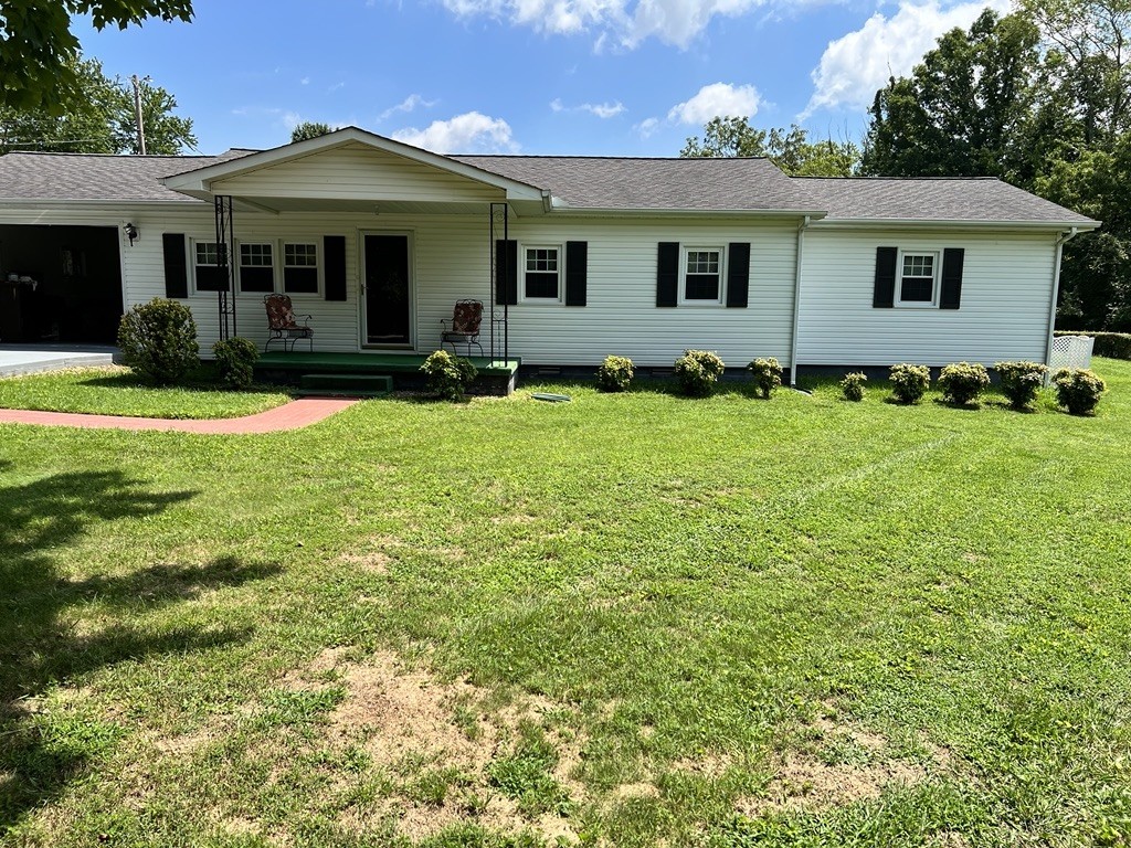 890 Hobbs Hill Road Tracy City, TN 37387 - Photo 16 of 31 a front view of a house with a yard