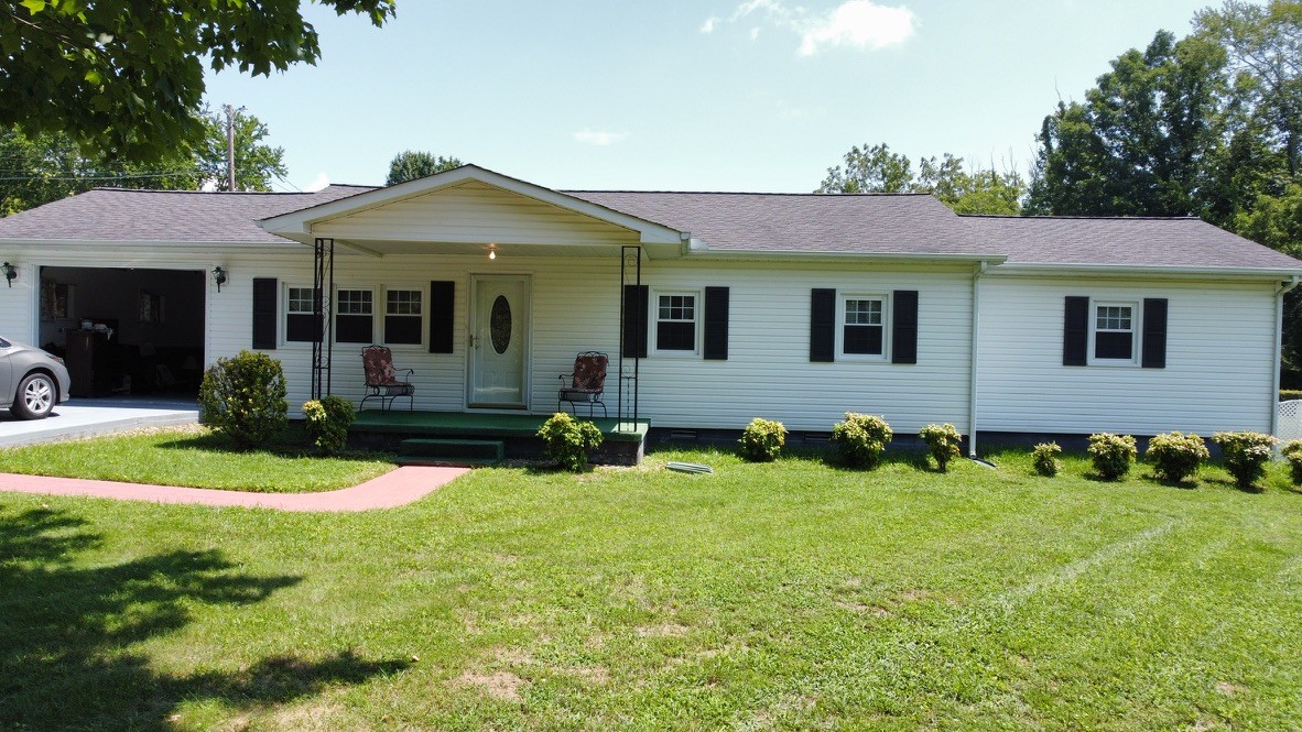 890 Hobbs Hill Road Tracy City, TN 37387 - Photo 23 of 31 a front view of a house with garden