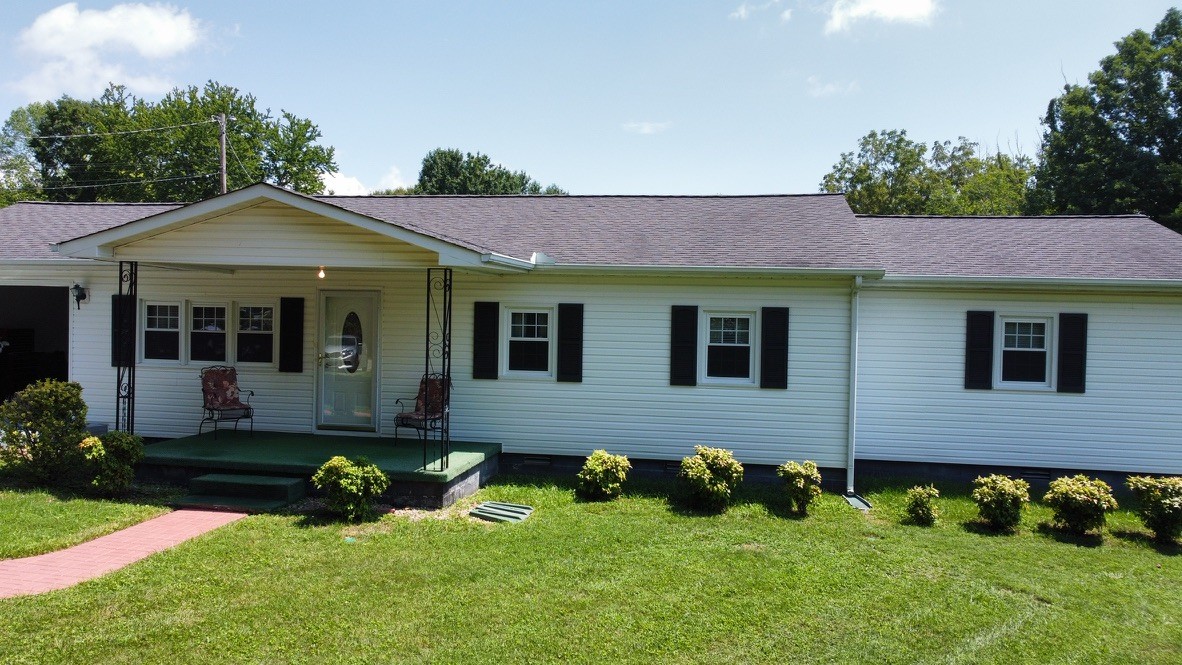 890 Hobbs Hill Road Tracy City, TN 37387 - Photo 25 of 31 a front view of a house with a yard