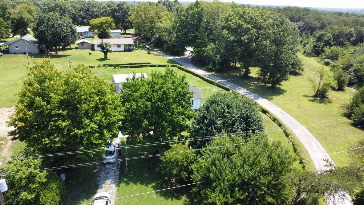 890 Hobbs Hill Road Tracy City, TN 37387 - Photo 29 of 31 a view of a swimming pool with a patio and a yard