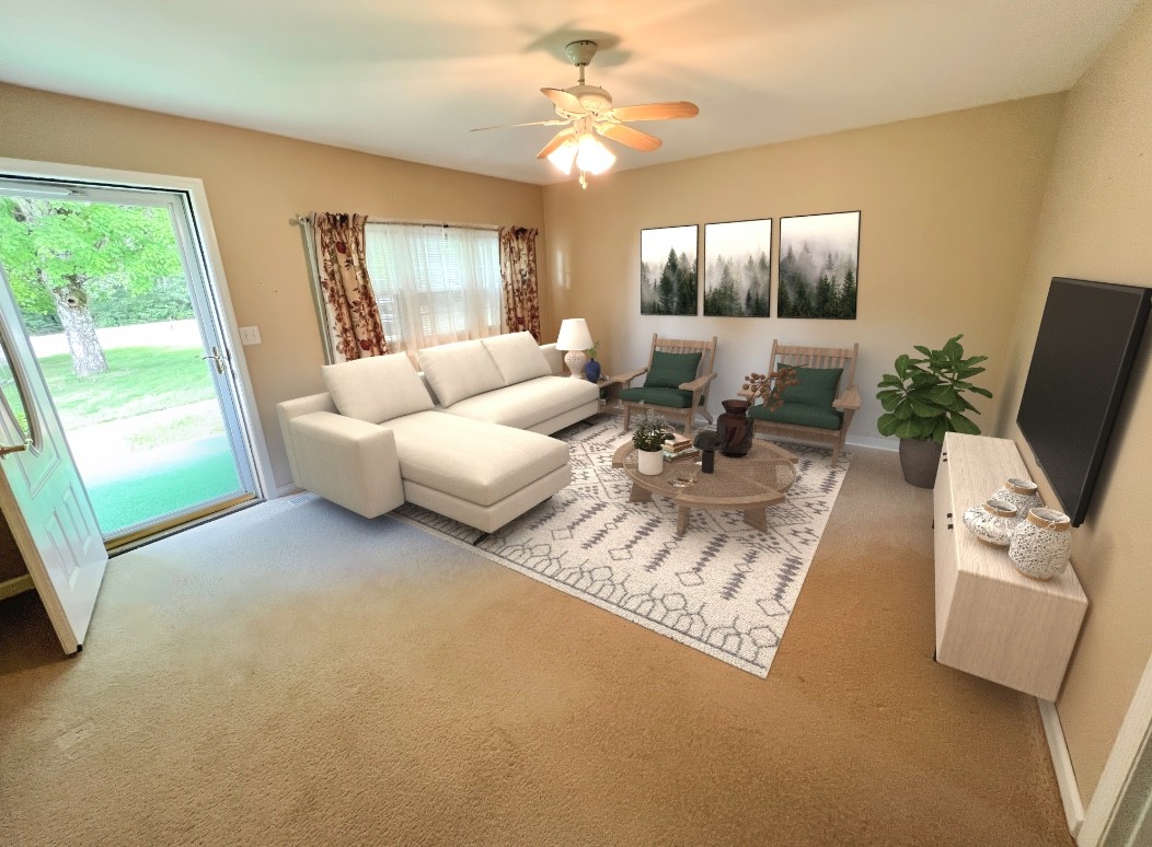 890 Hobbs Hill Road Tracy City, TN 37387 - Photo 3 of 31 a living room with furniture and a flat screen tv