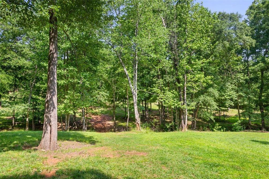 3143 Demooney Road College Park, GA 30349 - Photo 3 of 35 a view of a field with trees in the background