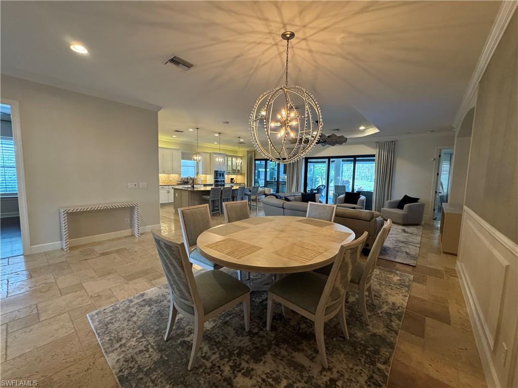 9470 Galliano Terrace Naples, FL 34119 - Photo 14 of 49 a view of a dining room with furniture