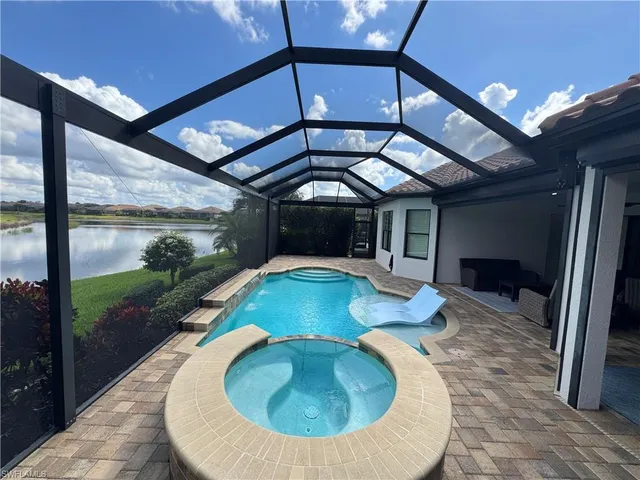 a view of a swimming pool with a patio