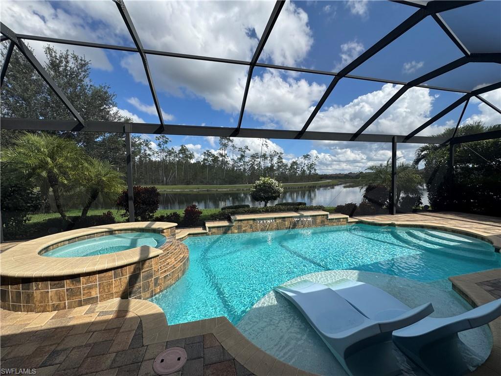 9470 Galliano Terrace Naples, FL 34119 - Photo 25 of 49 a view of a swimming pool with a patio