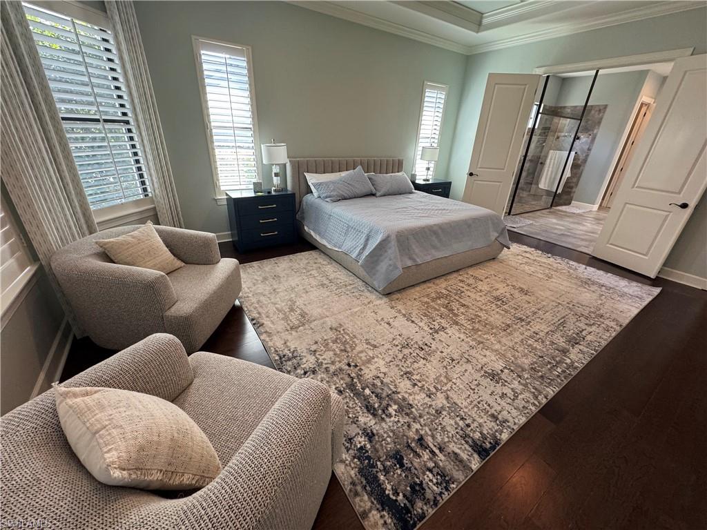 9470 Galliano Terrace Naples, FL 34119 - Photo 29 of 49 a bedroom with bed and a couch