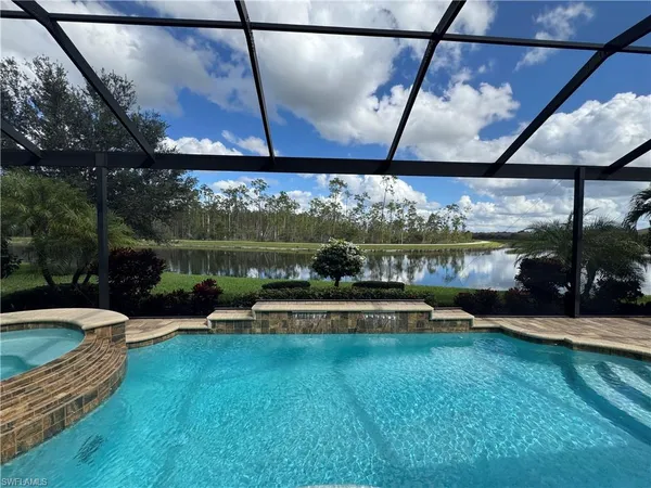 a view of a swimming pool with a patio