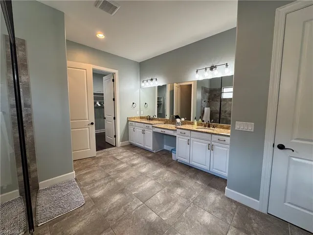 a bathroom with a shower and a toilet