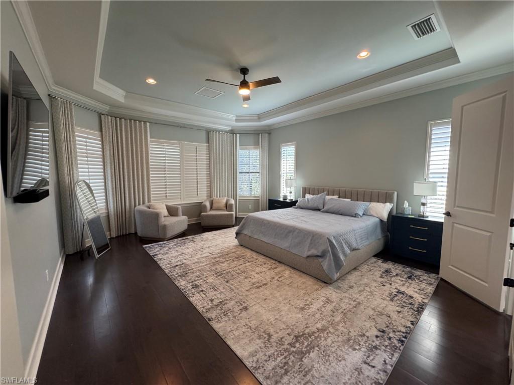 9470 Galliano Terrace Naples, FL 34119 - Photo 36 of 49 a bedroom with a large bed and a couch