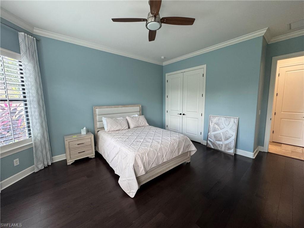 9470 Galliano Terrace Naples, FL 34119 - Photo 38 of 49 a bedroom with a bed and window