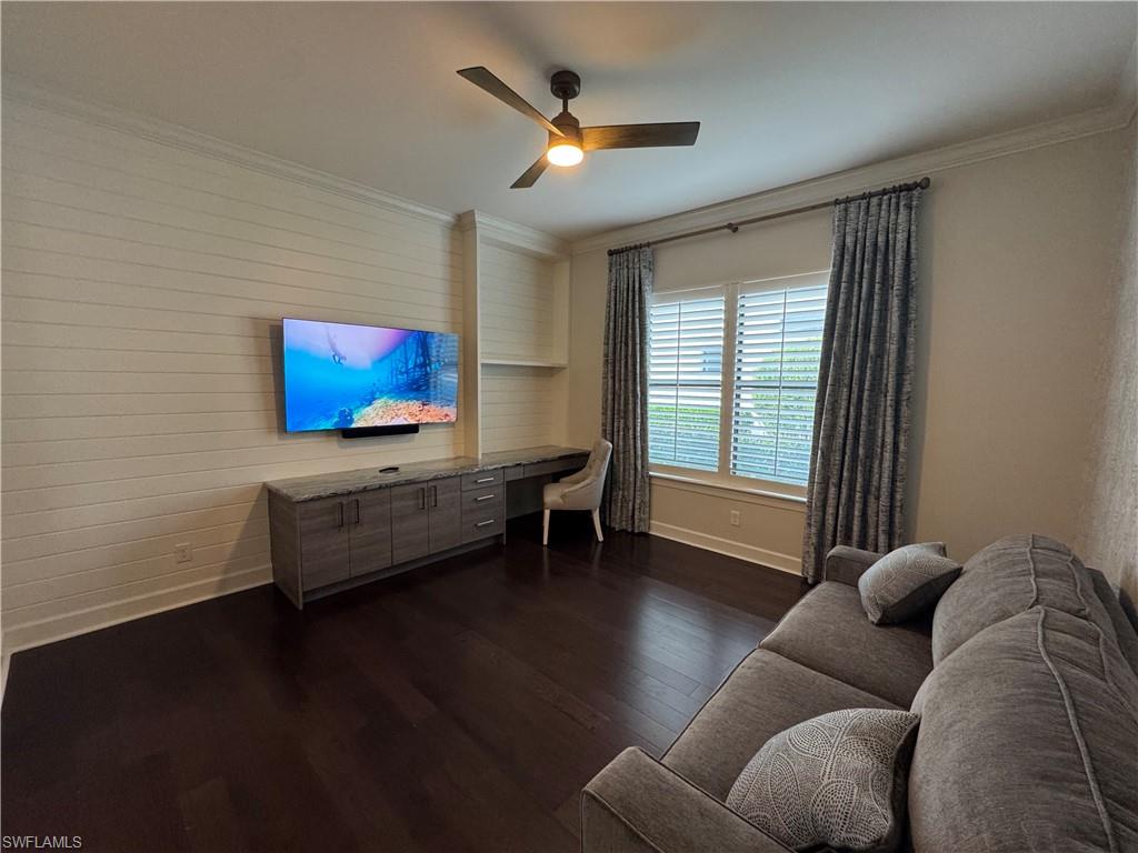 9470 Galliano Terrace Naples, FL 34119 - Photo 40 of 49 a living room with furniture and a flat screen tv
