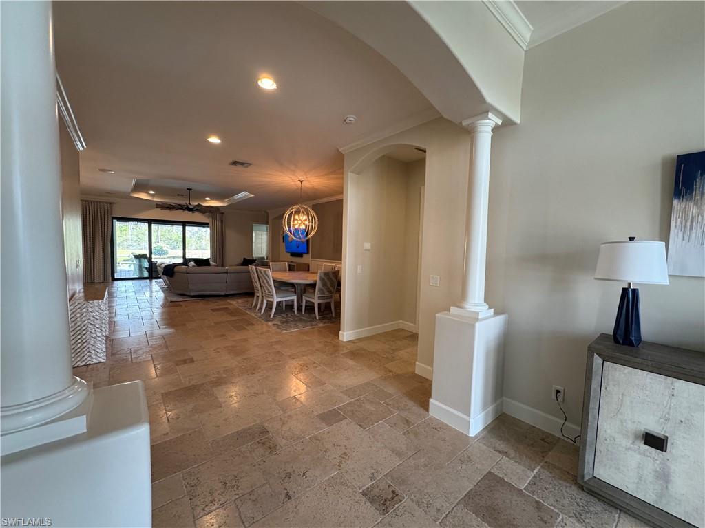 9470 Galliano Terrace Naples, FL 34119 - Photo 4 of 49 a lobby with furniture and floor to ceiling window