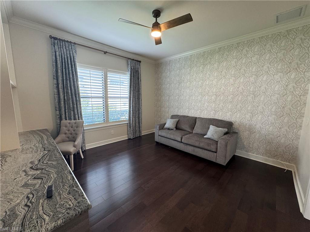 9470 Galliano Terrace Naples, FL 34119 - Photo 41 of 49 a living room with furniture and a wooden floor