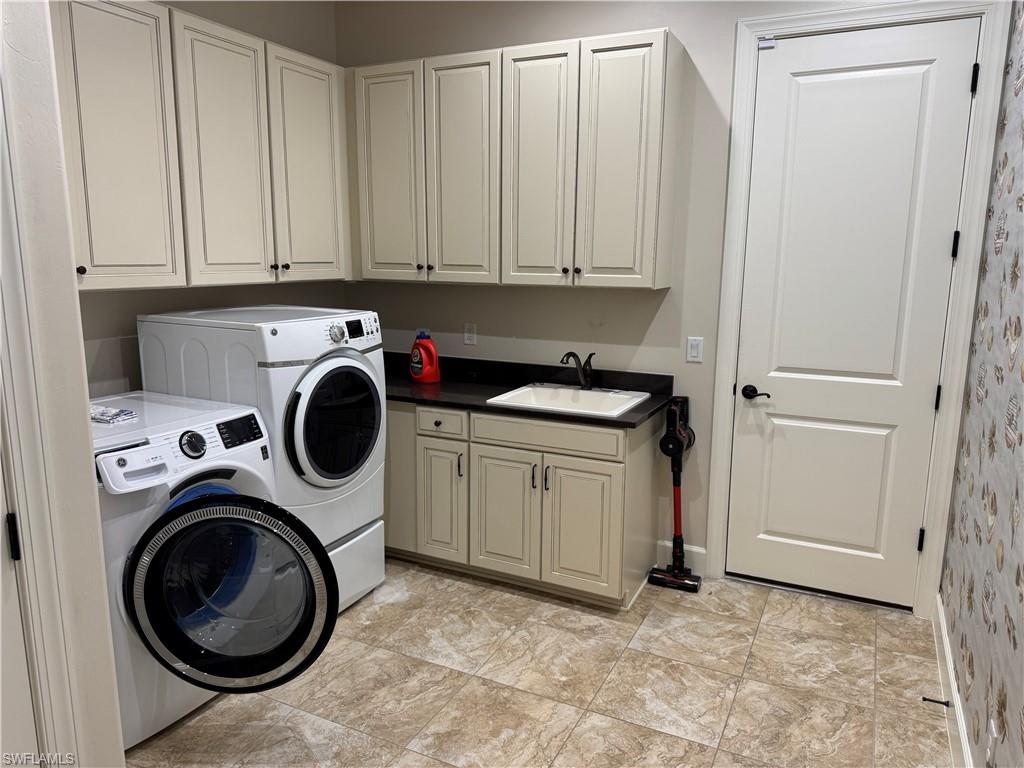 9470 Galliano Terrace Naples, FL 34119 - Photo 43 of 49 a utility room with sink dryer and washer