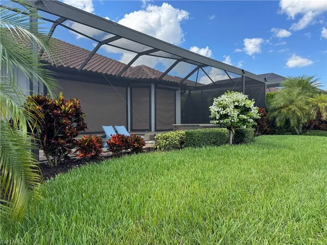a view of a lake with a house in the background