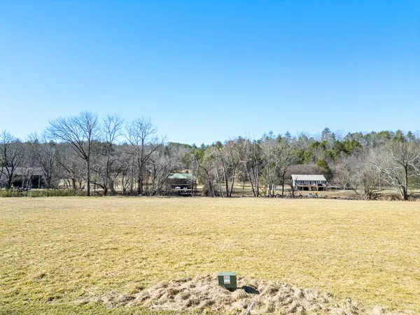 a swimming pool with trees in the background