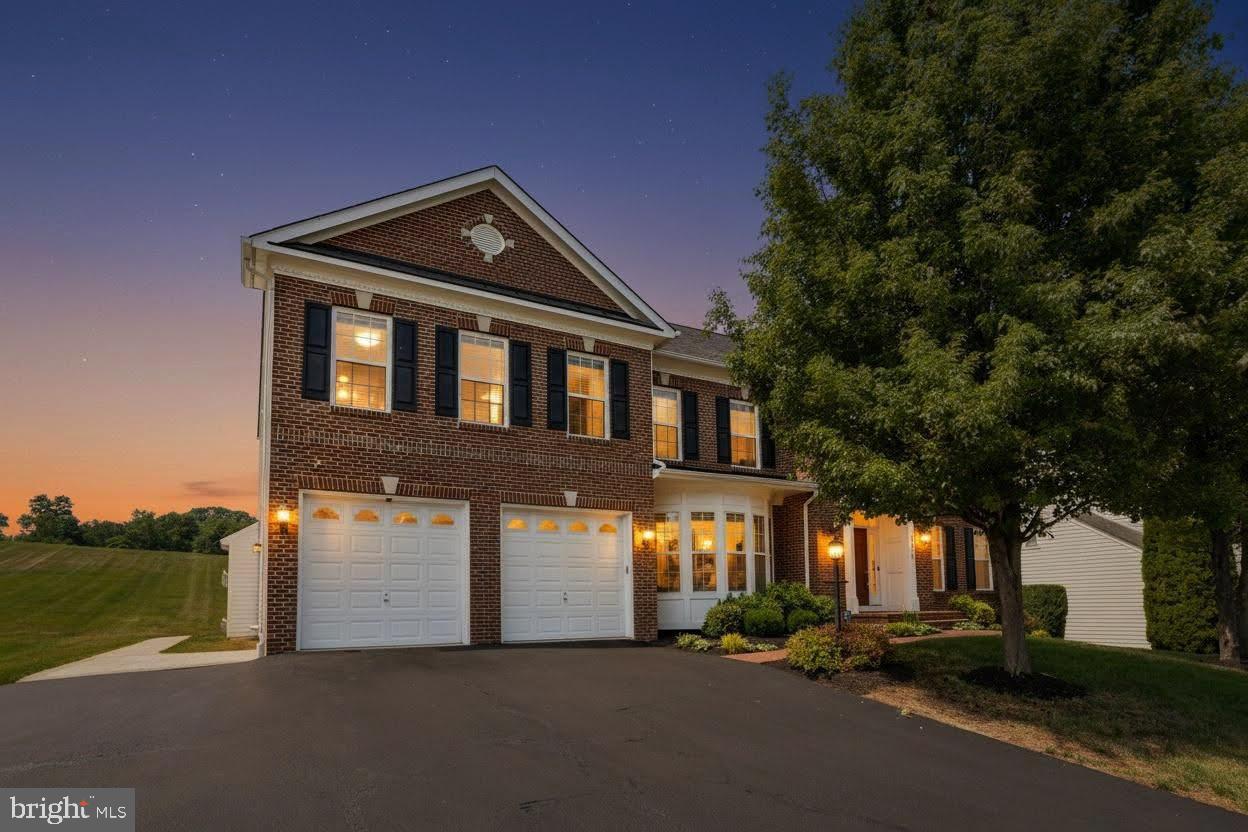 18475 Kerill Road Triangle, VA 22172 - Photo 2 of 99 a front view of a house with a yard