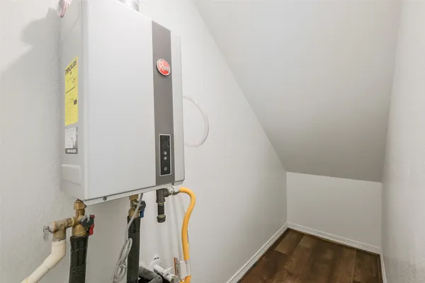 a bathroom with a double vanity sink toilet mirror and shower