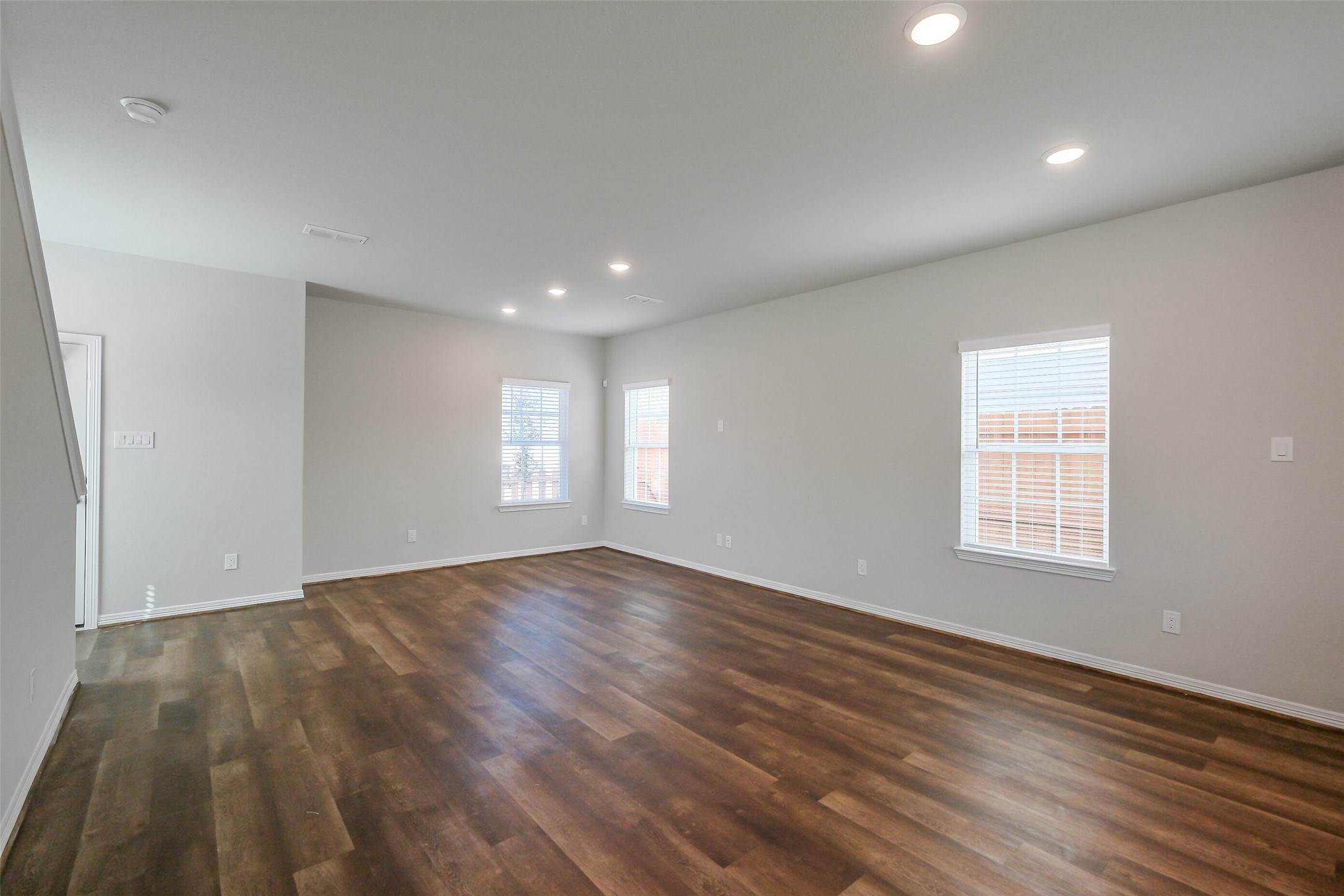 6407 Paris Street Houston, TX 77021 - Photo 9 of 31 wooden floor in an empty room with a window